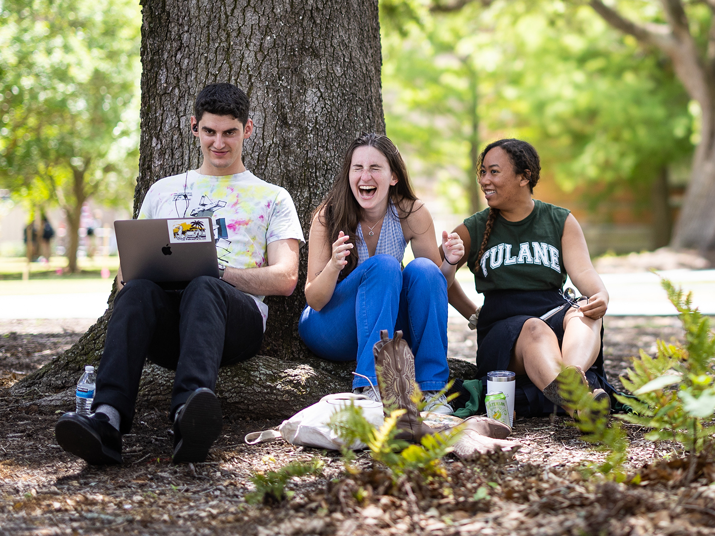 Students laughing on academic quad