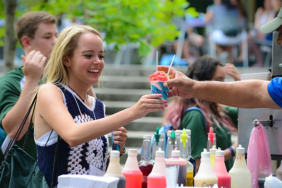 student receives sno ball during orientation